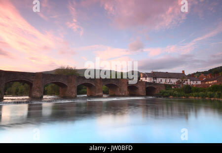 Crickhowell Bridge spanning the River Usk on the edge of historic Crickhowell town on a beautiful evening, Crickhowell, Powys, Wales, UK Stock Photo