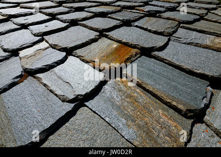 Old slate house roof from some ruins in North Italy. Great for background texture Stock Photo
