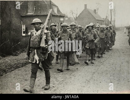 Official photograph taken on the British Western Front in France   The German offensive - Some of the gallant 55th going for a short rest after fighting hard - Stock Photo