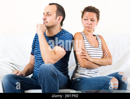 Young sad couple sorting out their relationship Stock Photo