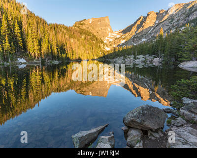 Morning Sun on Hallett Peak is reflected in Dream Lake in Rocky Mountain National Park, Colorado Stock Photo