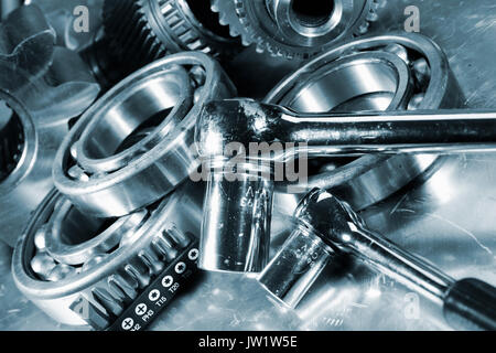 spanners with machine parts and tools, blue toning Stock Photo