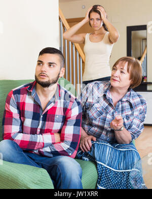 sad american family quarrels with the husbands mother Stock Photo