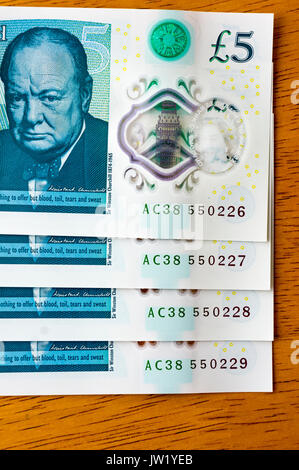 New UK five pound notes - released in September 2016 -  with consecutive serial numbers. Stock Photo