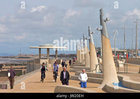 Walkers and cyclists sharing the seafront on a summer day in Cleveleys,Lancashire,UK Stock Photo