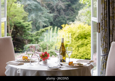 Gliffaes Hotel, Wales. Table setting for two in garden room Stock Photo