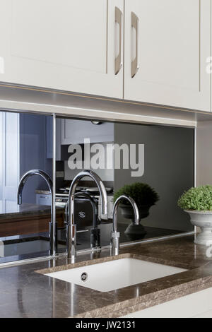 Small 'butlers' sink in modern kitchen Stock Photo