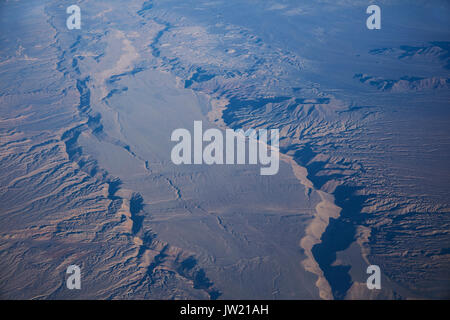Eroded valleys in Atacama Desert near Calama, Northern Chile, South America - aerial Stock Photo