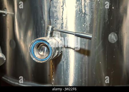 Close up ball valve on water tank Stock Photo
