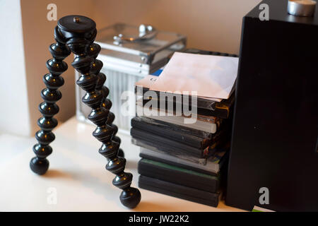 Mini tripod on table Stock Photo