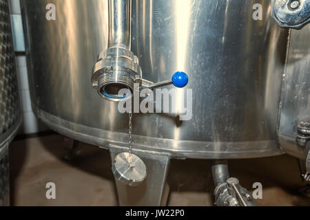 Wine tank discharge Stock Photo