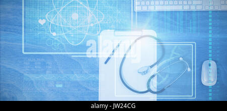 Atom and DNA helix interface against clipboard with keyboard and mouse on table Stock Photo