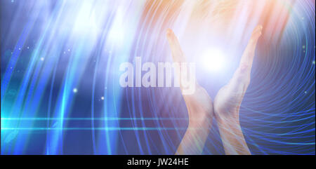 Hands gesturing against white background against background with shiny spiral Stock Photo