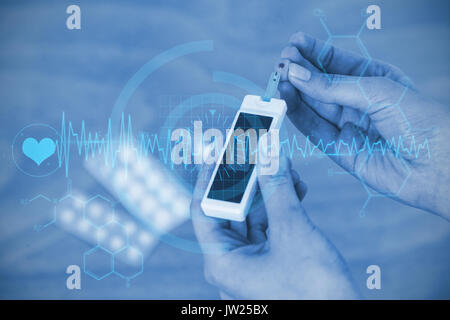 interface against close up of hands testing blood sugar with glucometer Stock Photo