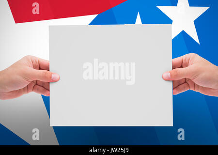 Hand showing card against digital composite of american flag Stock Photo