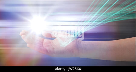 Cropped hand of woman offering against black background with shiny lines Stock Photo