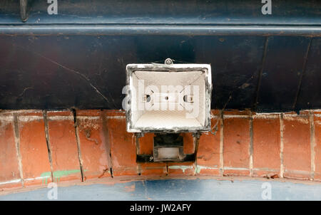 a metal overheard lamp outside above gate; UK Stock Photo