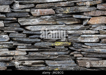 Dry stone wall made from slate at the Ballachulish slate quarry in Lochaber, Highland, Scotland, UK Stock Photo
