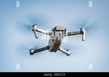 Flying quadrocopter, remote controlled drone with camera, DJI Mavic Stock Photo