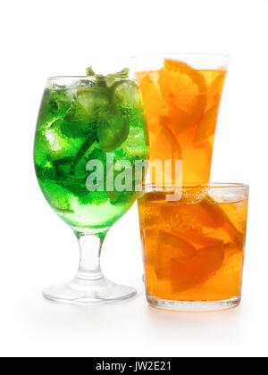 Three fresh citrus cocktails in different glasses. Llime and orange with ice. Isolated on white, clipping path included