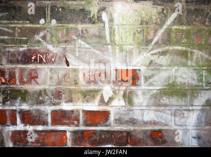 wall scratched and etched into inside tunnel; UK Stock Photo