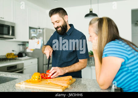 Mid adult couple cooking together Stock Photo