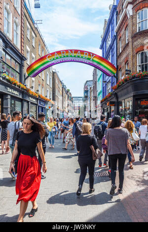 Shoppers and tourists in Carnaby Street, the famous pedestrianised shopping street in Soho, City of Wwestminster, London, England, UK Stock Photo