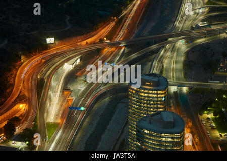 Motorways, Mapocho River, and office blocks viewed at night from Sky Costanera skyscraper, Santiago, Chile, South America Stock Photo