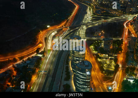 Motorways, Mapocho River, and office blocks viewed at night from Sky Costanera skyscraper, Santiago, Chile, South America Stock Photo