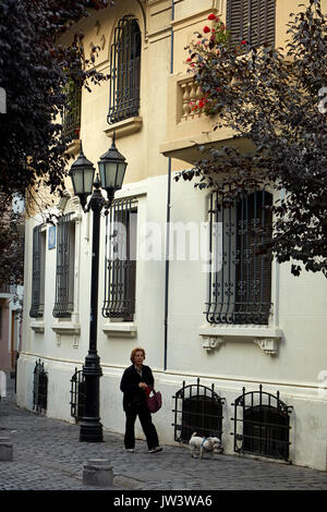 Lady walking dog in Barrio Paris-Londres, Santiago, Chile, South America Stock Photo