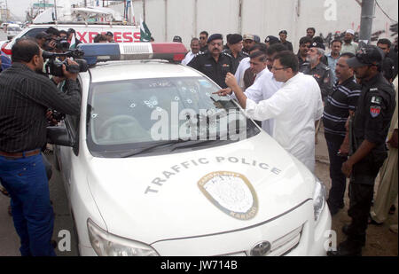 Pakistan. 11th August, 2017. View of venue after target killing of DSP traffic Hanif Khan, in Azizabad area of Karachi on Friday, August 11, 2017. DSP traffic Hanif Khan and his gunman Fida Alam were killed in an incident of target killing in Azizabad area of Karachi on Friday. According to police sources, the DSP and his gunman were in their vehicle when unidentified assailants opened fire at them. Credit: Asianet-Pakistan/Alamy Live News Stock Photo