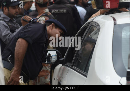 Pakistan. 11th August, 2017. View of venue after target killing of DSP traffic Hanif Khan, in Azizabad area of Karachi on Friday, August 11, 2017. DSP traffic Hanif Khan and his gunman Fida Alam were killed in an incident of target killing in Azizabad area of Karachi on Friday. According to police sources, the DSP and his gunman were in their vehicle when unidentified assailants opened fire at them. Credit: Asianet-Pakistan/Alamy Live News Stock Photo