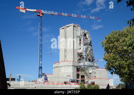 Arles, France. 11th August, 2017. Frank Gehry Tower Takes Shape in Arles. One of the latest projects by leading American architect, Frank Gehry, is taking shape in Arles, renowned for its annual 'Rencontres' Photo Festival, in southern France. Rising 58 metres above the low-rise town, the landmark building comprises an irregular tower clad in polished steel and glass panels. Due for completion next year, the tower will house an experimental arts centre, 'LUMA Arles', financed by Swiss philanthropist Maja Hoffmann. Credit: Chris Hellier/Alamy Live News Stock Photo