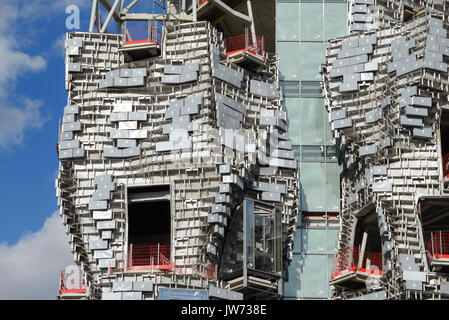 Arles, France. 11th August, 2017. Frank Gehry Tower Takes Shape in Arles. One of the latest projects by leading American architect, Frank Gehry, is taking shape in Arles, renowned for its annual 'Rencontres' Photo Festival, in southern France. Rising 58 metres above the low-rise town, the landmark building comprises an irregular tower clad in polished steel and glass panels. Due for completion next year, the tower will house an experimental arts centre, 'LUMA Arles', financed by Swiss philanthropist Maja Hoffmann. Credit: Chris Hellier/Alamy Live News Stock Photo