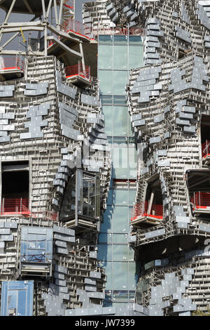 Arles, France. 11th August, 2017. Frank Gehry Tower Takes Shape in Arles. One of the latest projects by leading American architect, Frank Gehry, is taking shape in Arles, renowned for its annual 'Rencontres' Photo Festival, in southern France. Rising 58 metres above the low-rise town, the landmark building comprises an irregular tower clad in polished steel and glass panels. Due for completion next year, the tower will house an experimental arts centre, 'LUMA Arles', financed by Swiss philanthropist Maja Hoffmann. Credit: Chris Hellier/Alamy Live News Stock Photo