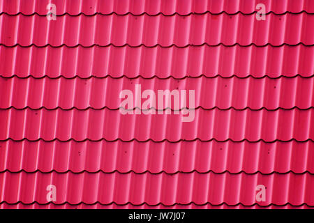 Roof Covered with Red Corrugated Metal Tiles Stock Photo