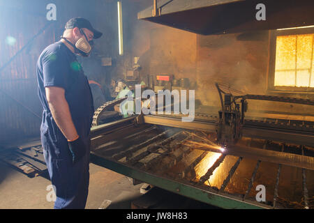 CNC plasma cutting machine during operation. Stock Photo