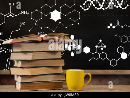 Digital composite of Books on Desk foreground with blackboard graphics of science formula drawings diagrams