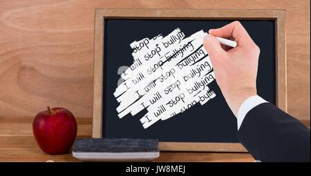 Digital composite of Hand writing i will stop bullying on blackboard Stock Photo