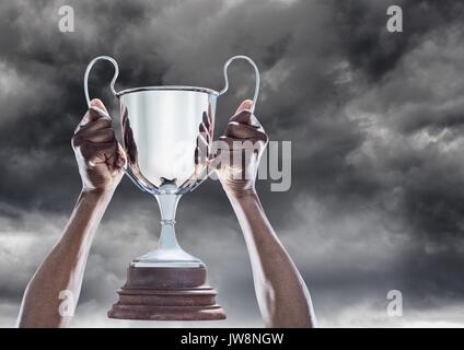 Digital composite of Man with a trophy on hands Stock Photo