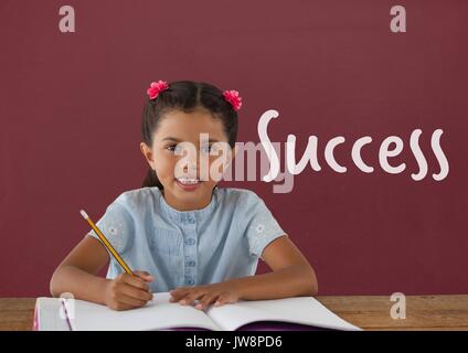 Digital composite of Student girl at table against red blackboard with success text Stock Photo