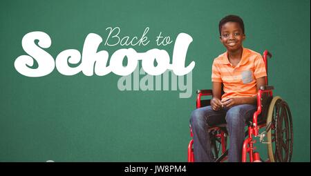Digital composite of Back to school text on blackboard with disabled boy in wheelchair Stock Photo