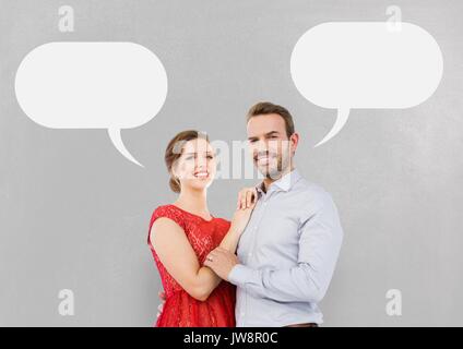 Digital composite of Couple with speech bubble against grey background Stock Photo