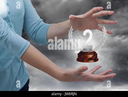 Digital composite of Woman with a trophy on hands Stock Photo