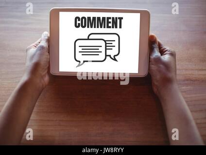 Digital composite of Comment text and chat graphic on tablet screen with hands Stock Photo