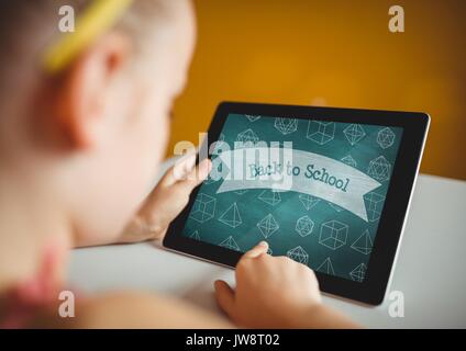Digital composite of Girl holding a tablet with school icons on screen Stock Photo