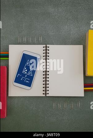 Digital composite of Phone on a school table with school icons on screen Stock Photo