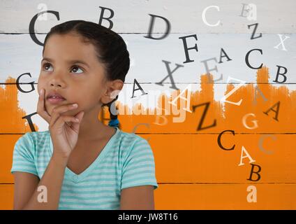 Digital composite of Many letters around Girl thinking in front of orange painted background Stock Photo