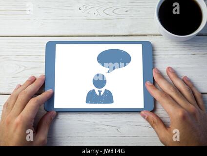 Digital composite of Chat icon profile on tablet with hands Stock Photo