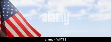 Digital composite of USA flag against sky background Stock Photo